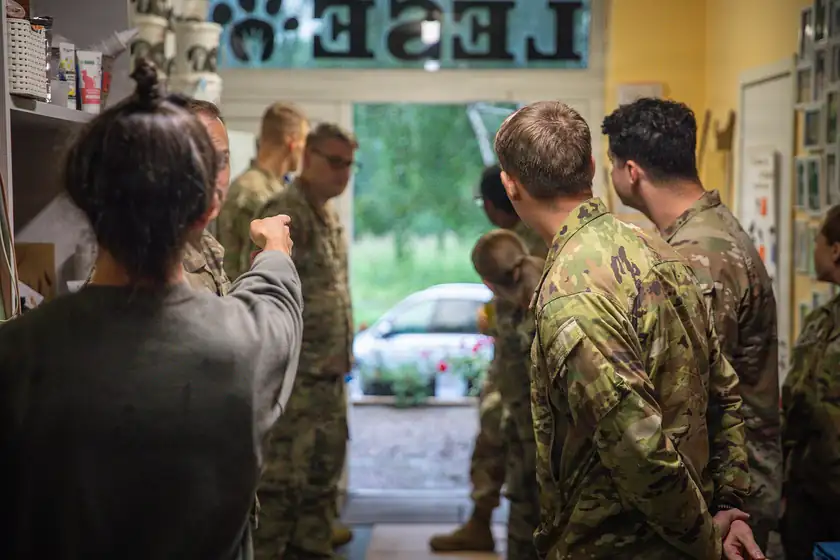 Adult volunteers gathered inside an animal shelter