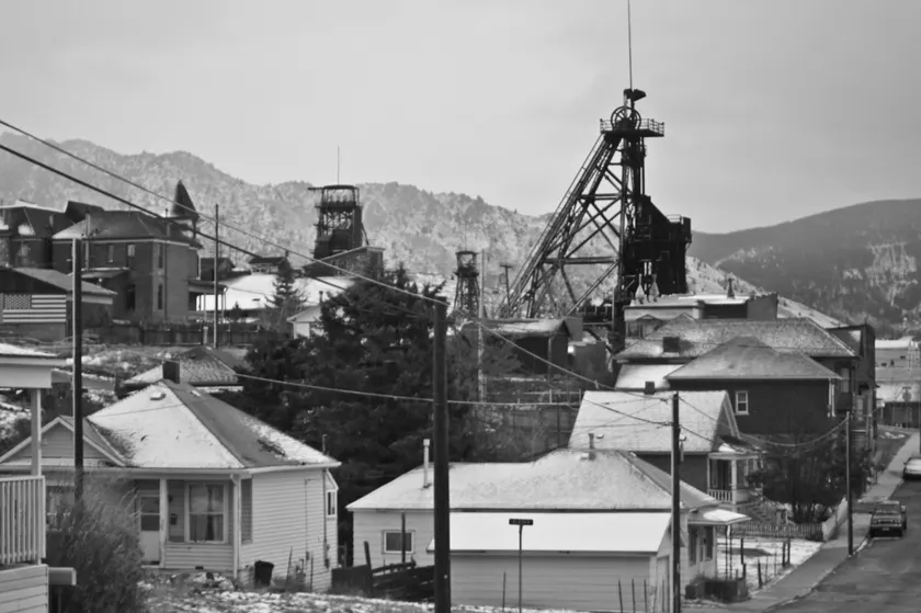 Historic brick buildings climbing a steep street in uptown Butte, Montana