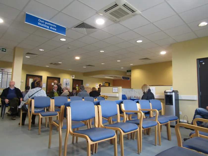 People sitting in an outpatient waiting room