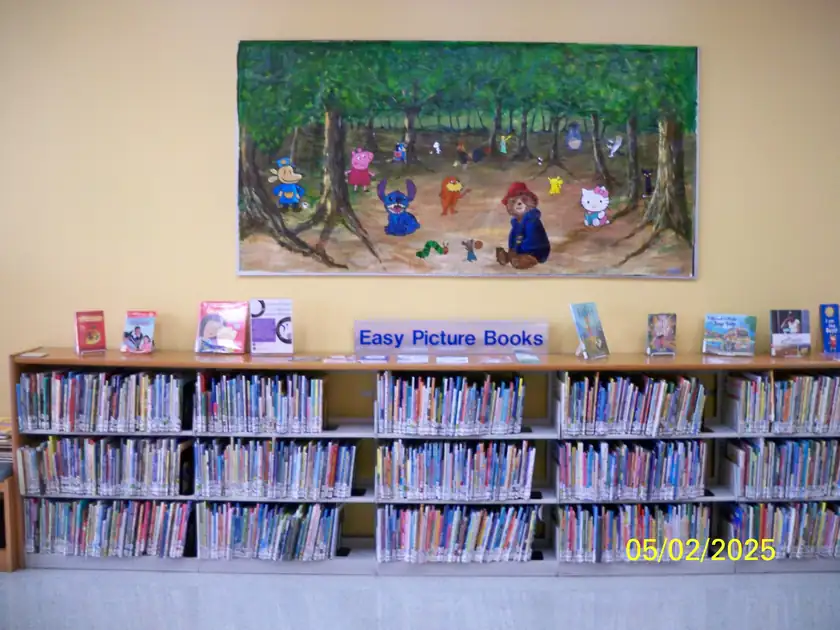 Children's picture books standing in a row on a shelf