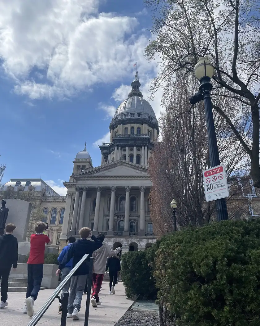 The white dome of the Illinois State Capitol against a blue sky