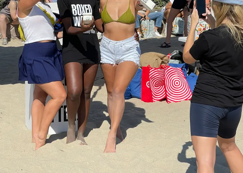 Volunteers standing together on a beach during a cleanup
