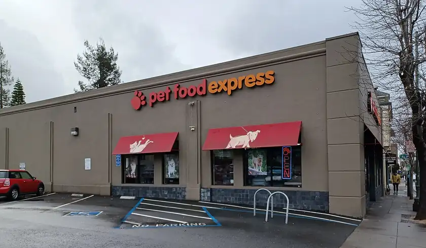 The storefront of a pet-supply shop on a city street